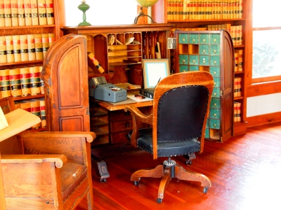 [Large desk with front which opens to the sides revealing many storage compartments.]